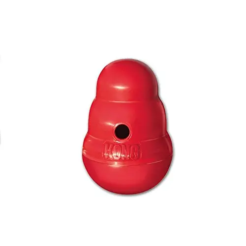 KONG Wobbler, red and white round base, small size, with kibble spilling from top