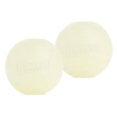 Two white Chuckit! Max Glow Balls, medium size, glowing faintly