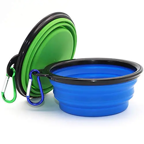Two COMSUN collapsible dog bowls in blue and green with carabiners