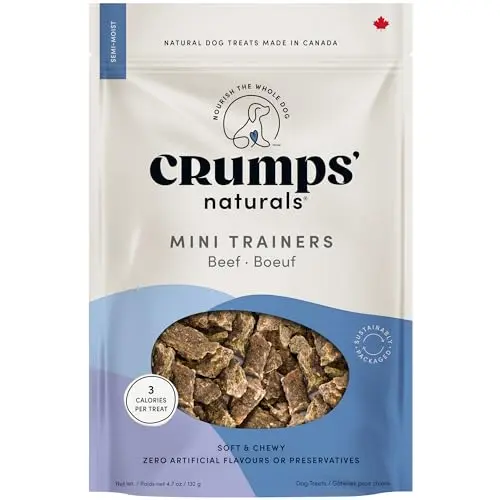 Crumps Naturals Mini Trainers Beef semi-moist training treats bag next to a golden retriever puppy.