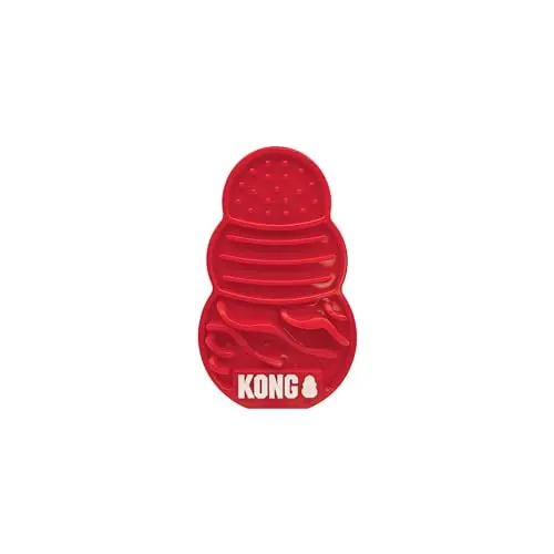 KONG Licks treat dispenser, small red silicone pad with suction cups, filled with peanut butter