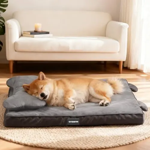 Grey orthopedic dog bed with bone-shaped headrest pillow